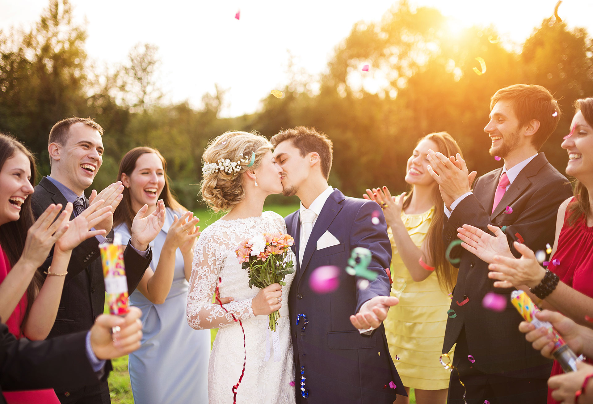 groom and bride kissing at the wedding ceremony