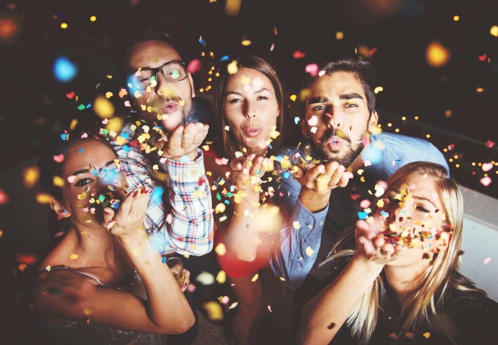 Group celebrating their event with confetti