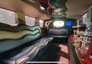 Hummer limo interior with mirror ceiling, drinks bar and limo style bench seating