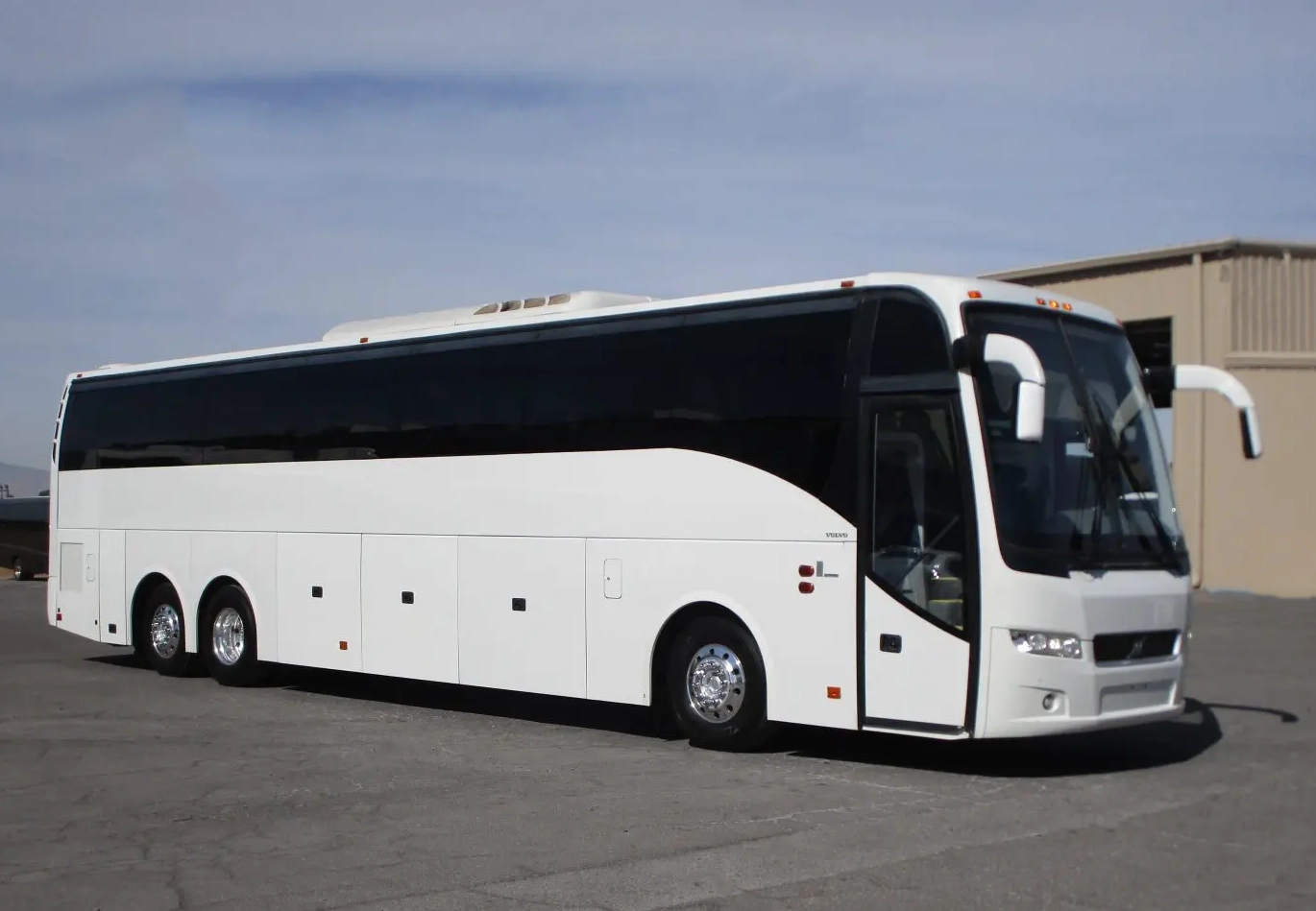 white 50 passenger motorcoach exterior with underbelly luggage storage