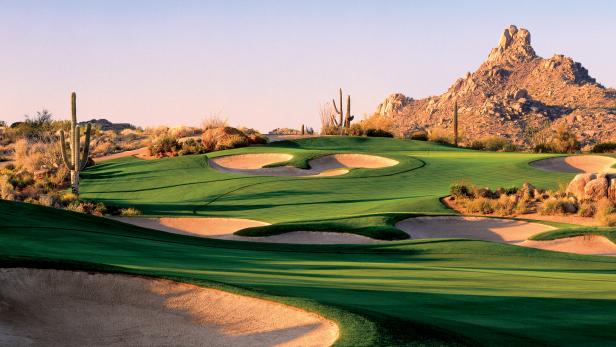 view of Arizona golf course with greens and cactus