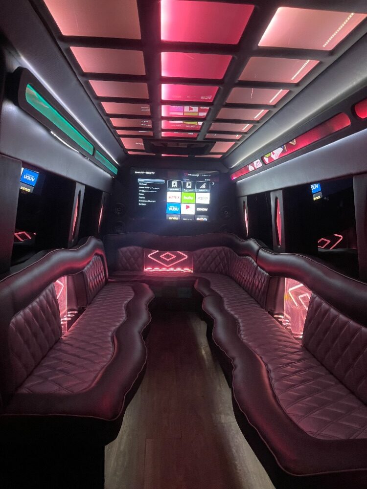 Mercedes Sprinter limo style Party Bus interior with leather bench seating, party lights, built in bars