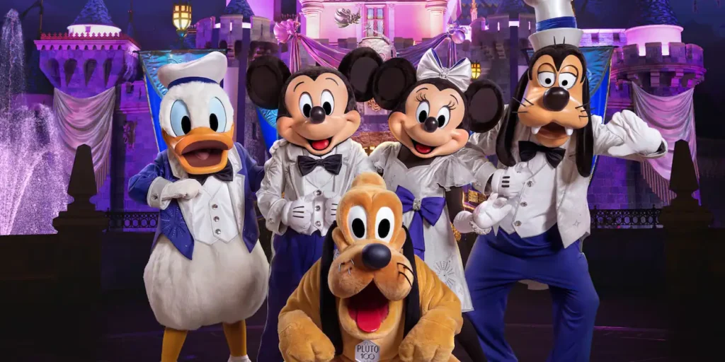 Mickey, Minnie, Donald, Goofy, and Pluto in front of the castle at Disneyland