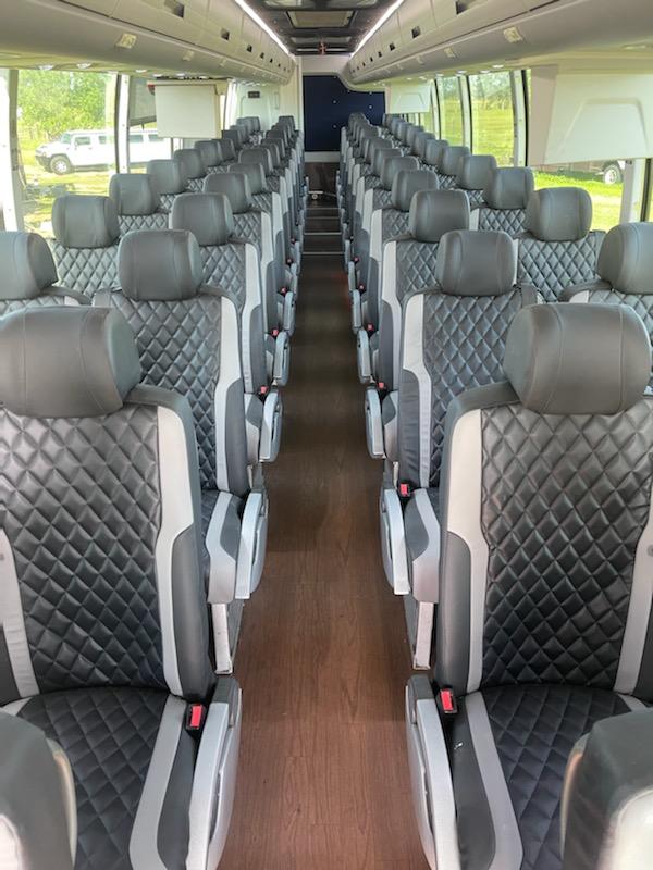 54-passenger motorcoach with leather seating and wood paneled flooring