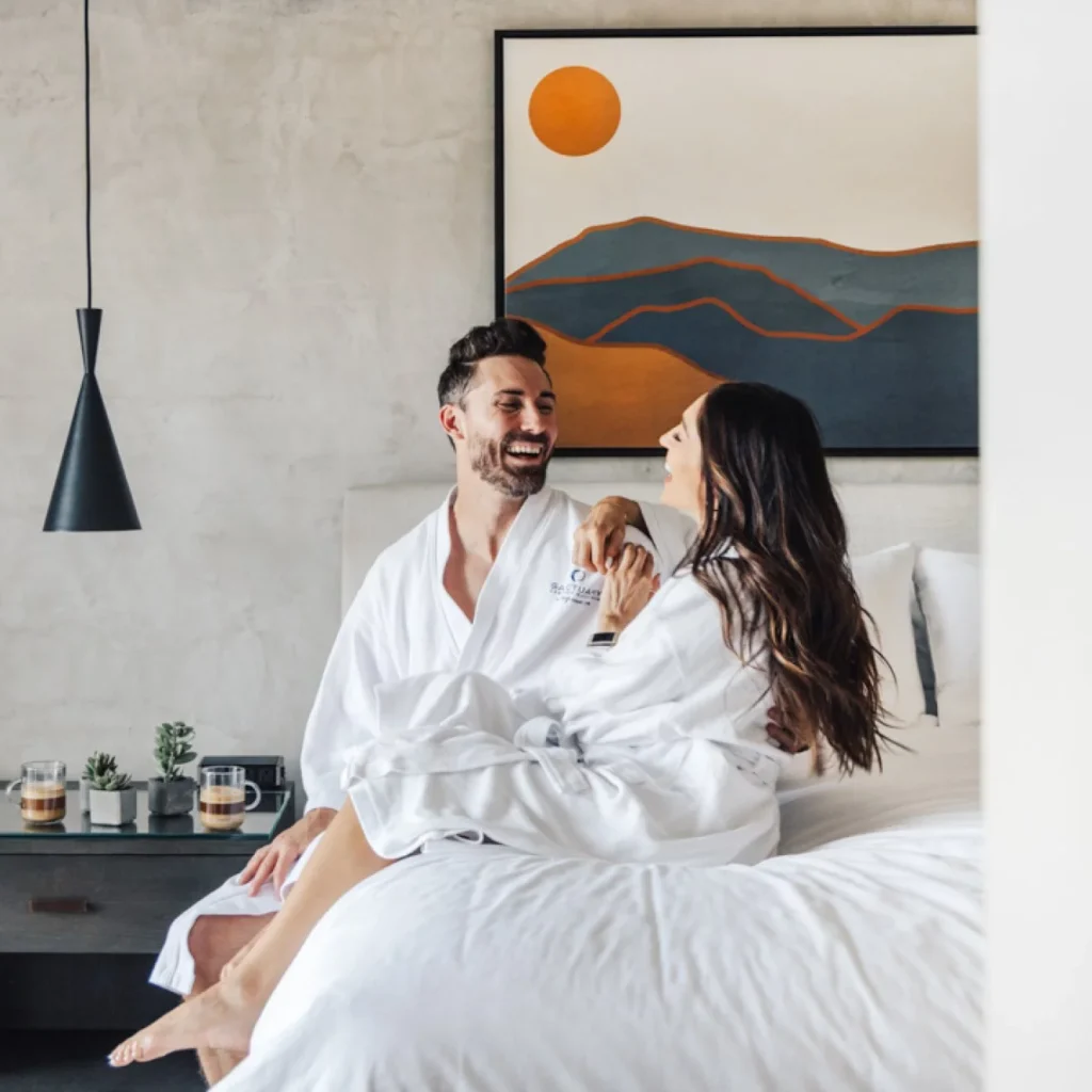 Couple in comfy robes in their hotel room at Sanctuary Camelback