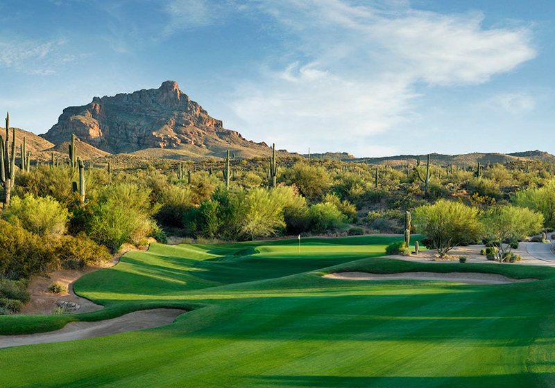 View of the green at Wekopa golf course with mountain views in the background